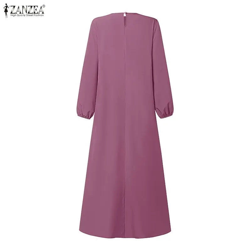 The Elara Pleated A-Line Maxi Dress from the Boss Energy at Lavishly Me