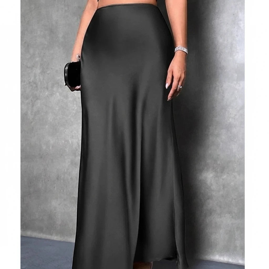 Lavishly Me black satin maxi skirt with a fluid, floor-length silhouette and minimalist design.
